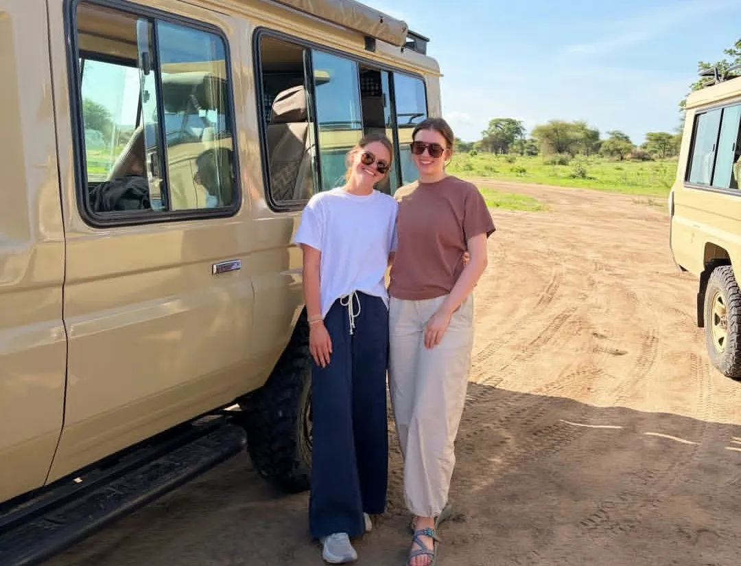 Guests clinking glasses at a Serengeti sundowner